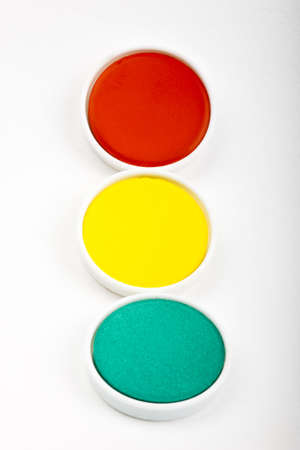 Multicolored water color box on white background