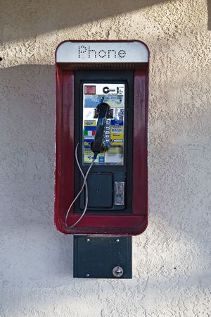 Typical red public payphone in the USA