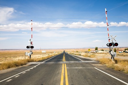 Railroad crossing with gates in New Mexico, USAの写真素材