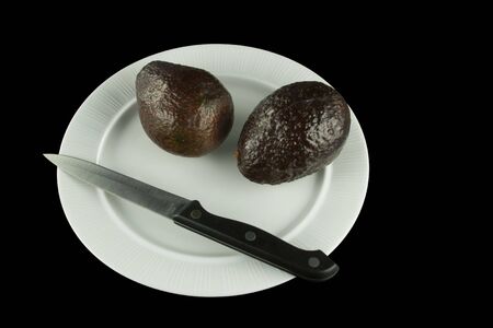 Two avocados on plateの写真素材