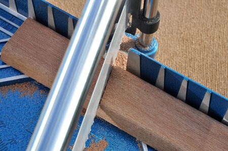 Sawing wood manually with a miter saw