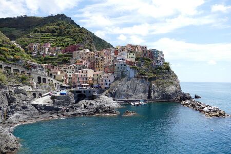 Manarola Manaea in the local dialect is a small town, a frazione of the comune municipality of Riomaggiore, in the province of La Spezia, Liguria, northern Italy. It is the second smallest of the famous Cinque Terre towns frequented by tourists.の写真素材
