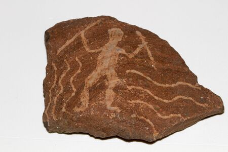 Replica of stone age art showing shaman surrounded by stylised snakes