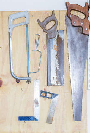 Saws necessary for home maintenance on suburban workshop