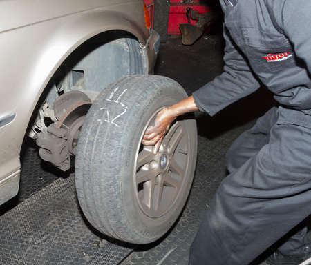 Checking spare tyre in boot of BMW at workshopのeditorial素材