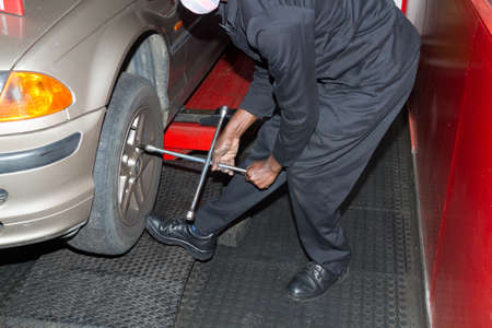 Checking spare tyre in boot of BMW at workshopのeditorial素材