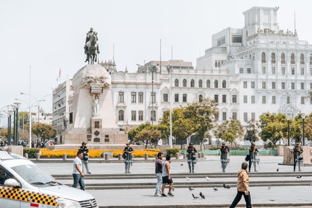 Lima, Peru - January 20, 2023: Police men on the streets at San Martin Squareのeditorial素材