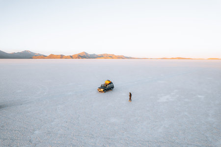 Drone Aerial Photo of Car and person Bolivia Salar de Uyuni Salt Flatsの写真素材