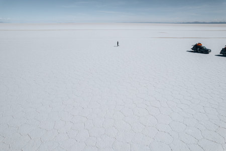 Drone Aerial Photo of Car and person Bolivia Salar de Uyuni Salt Flatsの写真素材