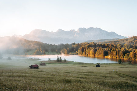 Amazing foggy Sunrise at Geroldsee, also Wagenbruchsee, Bavaria, Germany Europeの写真素材