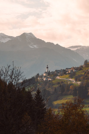 Church on a mountain during sunset in Trentino Alto Adige Dolomites Tyrol Italyの写真素材