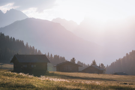 Mountain cabin in stunning landscape of Alpe di Siusi during sunrise, Dolomitesの写真素材