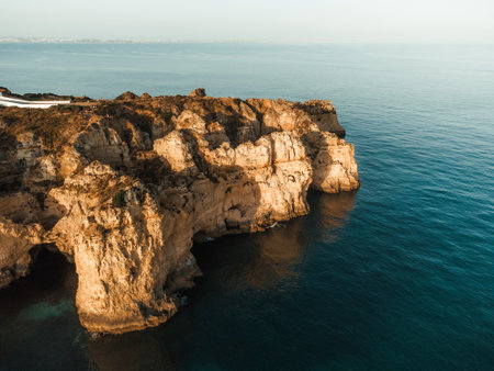 Aerial Drone view of Ponta da Piedade during sunset in Lagos Algarve, Portugalの素材 [FY310209627583]