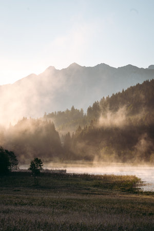 Amazing foggy Sunrise at Geroldsee, also Wagenbruchsee, Bavaria, Germany Europeの写真素材