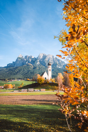 Bright photo of St. Constantine church in Dolomites, Trentino Alto Adige Italyの写真素材