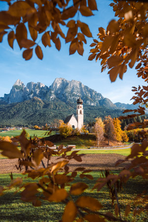 Bright photo of St. Constantine church in Dolomites, Trentino Alto Adige Italyの写真素材