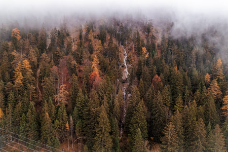 Moody Aerial photo of Fernsteinsee lake in Austria in autumn season