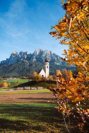 Bright photo of St. Constantine church in Dolomites, Trentino Alto Adige Italyの写真素材