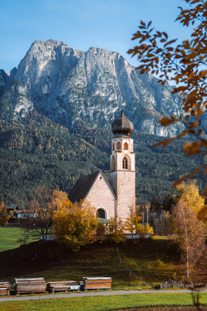 Bright photo of St. Constantine church in Dolomites, Trentino Alto Adige Italyの写真素材