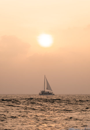Sail boat in Mirissa Sri Lanka under the sun during sunsetの写真素材