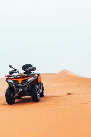 Quad bike in Sahara Desert on a cloudy day in Merzouga, Morocco
