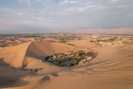 Aerial sunset photo of desert oasis Huacachina, Ica, Peru, South Americaの写真素材