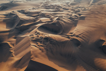 Aerial sunset photo of desert textures in Huacachina, Ica, Peru, South Americaの写真素材
