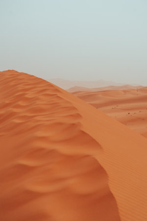Sand texture during sunrise, Sahara Desert Merzouga, Morocco landscape orientedの写真素材