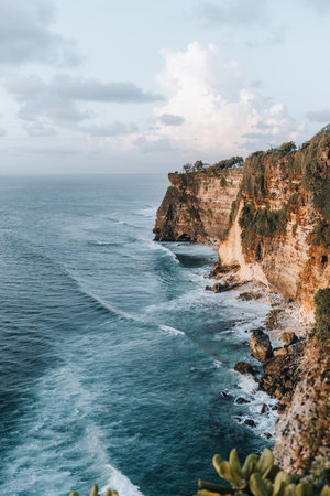 Rocky cliff coastline and ocean, sea, near Uluwatu temple in Bali, Indonesiaの写真素材