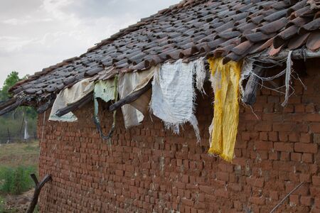 Laundry hanging from a rooftop in Indiaの写真素材