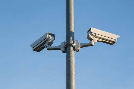 Two security cameras on a lightpole