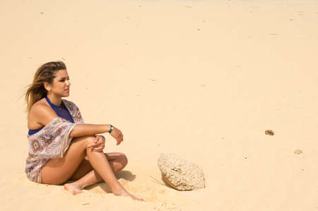 Pretty young woman in the sandの写真素材