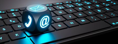Luminous cube with communication symbols on keyboardの写真素材