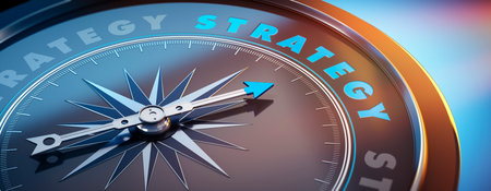 Dark compass with needle pointing to the word strategyの写真素材