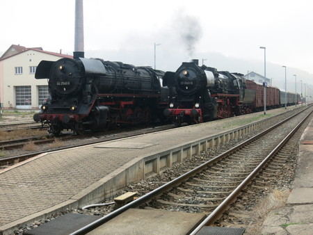 Two steam locomotives, one with passenger trainのeditorial素材