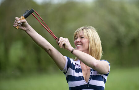 Woman firing a catapultの写真素材
