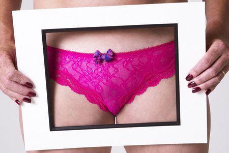 Woman showing panties in frameの写真素材