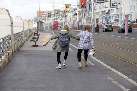 Teenagers fooling around along the roadsideのeditorial素材