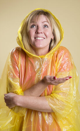 Woman in Poncho in wet weatherの写真素材