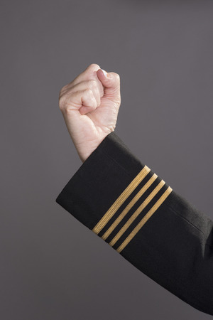 Airline officer making a gesture with her hand A clenched fistの写真素材