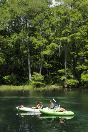 Family kayaking on the Rainbow River at Dunnellon Florida USAのeditorial素材