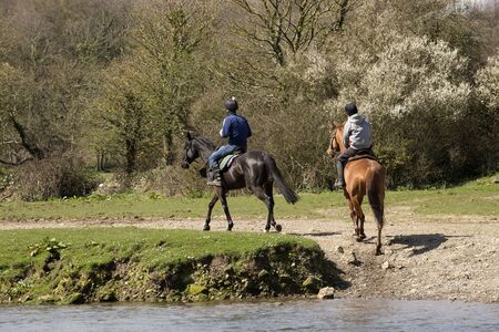 Horse riders on the Ogmore River in South Wales UKのeditorial素材