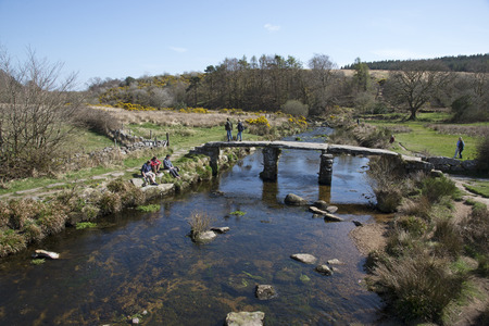 Ancient Clapper bridge at Postbrige on Dartmoor Devon UK