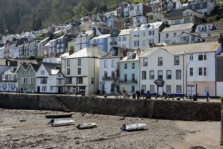 River Dart at low tide overlooked by colourful properties at Dartmouth Devon UKのeditorial素材