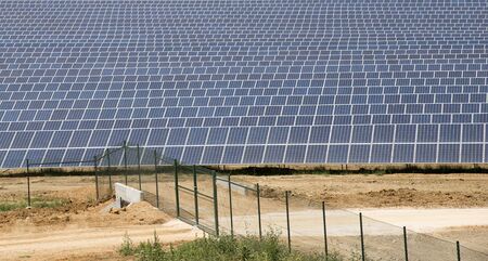 Commercial solar panels and security fence.