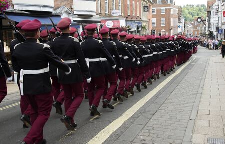 Rear view of marching soldiers Winchester Hampshire UKのeditorial素材