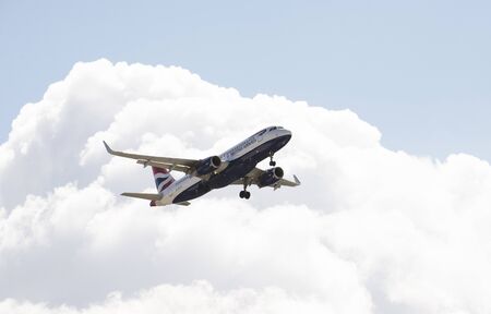 British Airways A320 passenger jet with gear down ready for landingのeditorial素材