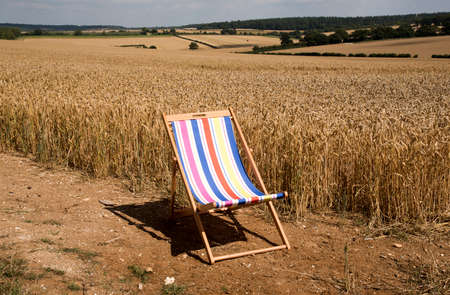 Open deckchair in countrysideの写真素材