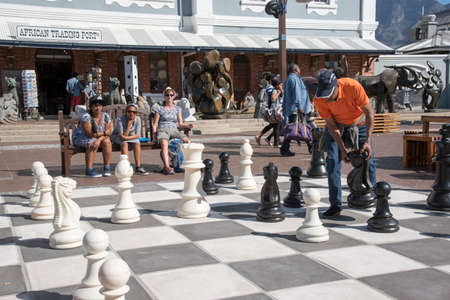 Players enjoy a game of street chess on the Waterfront in Cape Town South Africaのeditorial素材