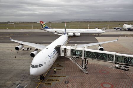 CAPE TOWN INTERNATIONAL AIRPORT SOUTH AFRICA Passengers loading a SAA A340-600